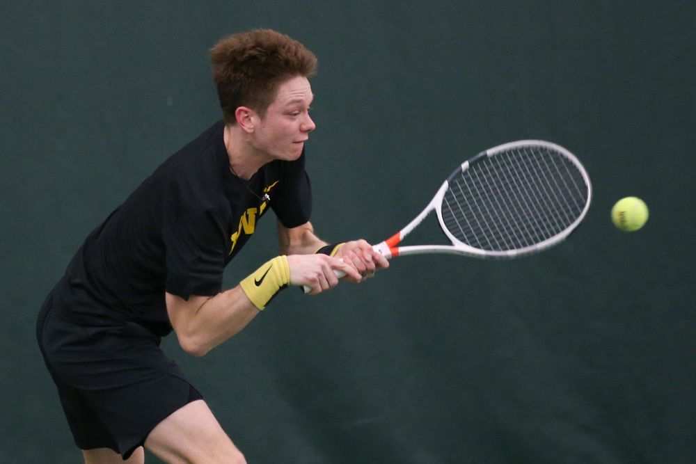 Iowa’s Jason Kerst returns a hit during the Iowa men’s tennis meet vs VCU on Saturday, February 29, 2020 at the Hawkeye Tennis and Recreation Complex. (Lily Smith/hawkeyesports.com)