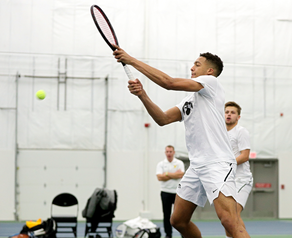 Iowa’s Oliver Okonkwo returns a shot during his doubles match at the Hawkeye Tennis and Recreation Complex in Iowa City on Sunday, February 16, 2020. (Stephen Mally/hawkeyesports.com)