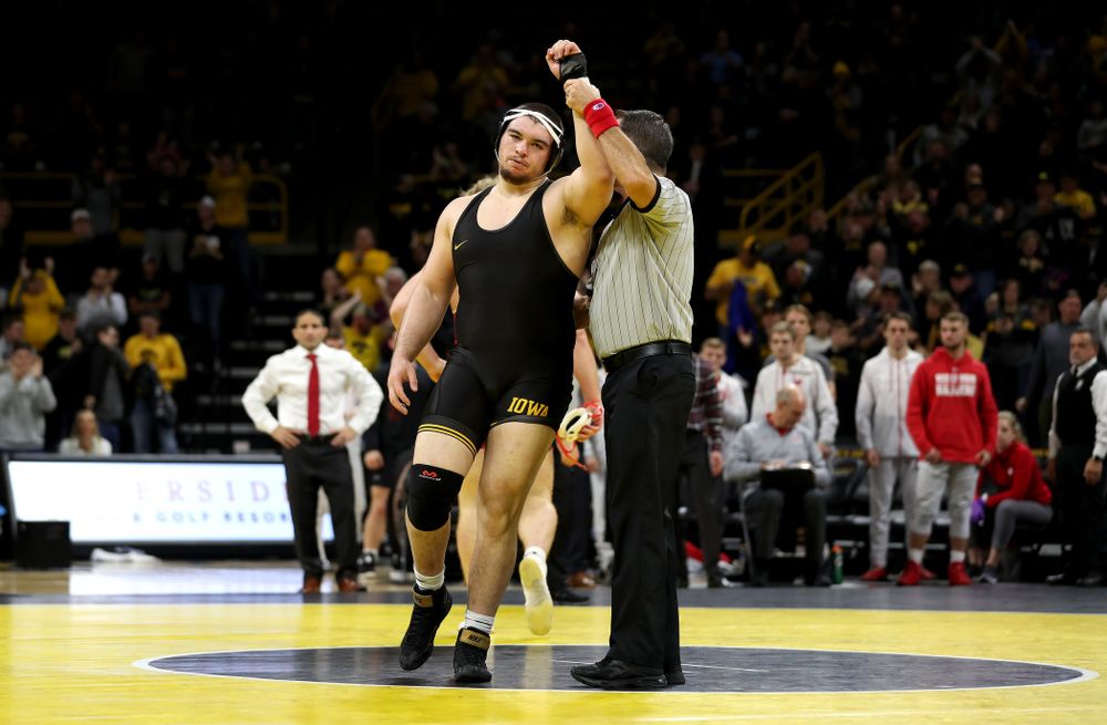 IowaÕs Tony Cassioppi wrestles WisconsinÕs Trent Hillger at heavyweight Sunday, December 1, 2019 at Carver-Hawkeye Arena. Cassioppi won the match 3-2. (Brian Ray/hawkeyesports.com)