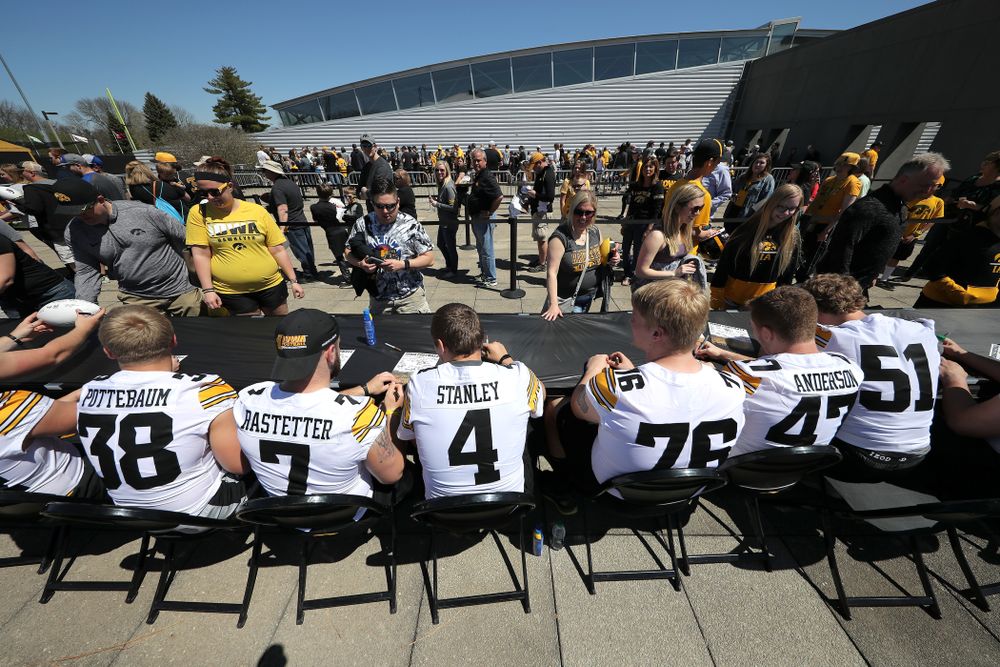 Members of the Iowa Football team sign autographs before the Iowa Hawkeyes game against the Nebraska Cornhuskers Saturday, April 20, 2019 at Duane Banks Field. (Brian Ray/hawkeyesports.com)