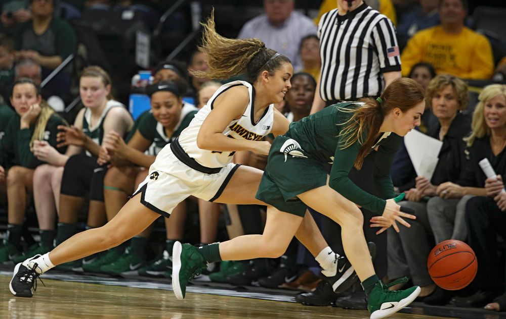 Iowa Hawkeyes guard Gabbie Marshall (24) pressures Michigan State Spartans guard Taryn McCutcheon (4) which led to a turnover during the fourth quarter of their game at Carver-Hawkeye Arena in Iowa City on Sunday, January 26, 2020. (Stephen Mally/hawkeyesports.com)