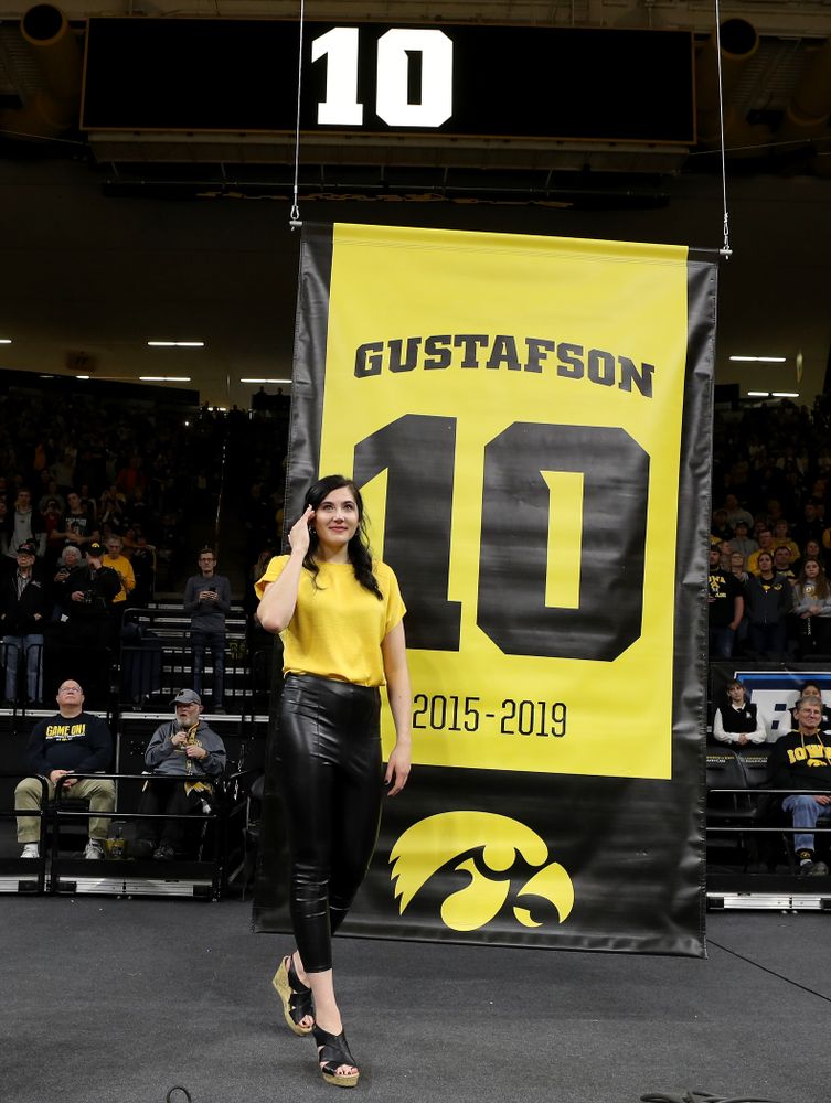 Megan Gustafson stands with her family as her number is raised into the rafters during a jersey retirement ceremony Sunday, January 26, 2020 at Carver-Hawkeye Arena. (Brian Ray/hawkeyesports.com)
