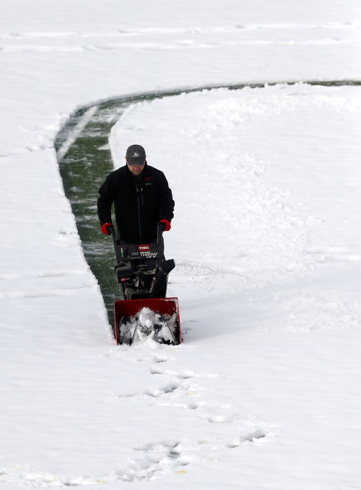 Members of the Iowa Athletics Turf Management staff create the #SnowWave for kids in the Stead Family Children's Hospital Thursday, February