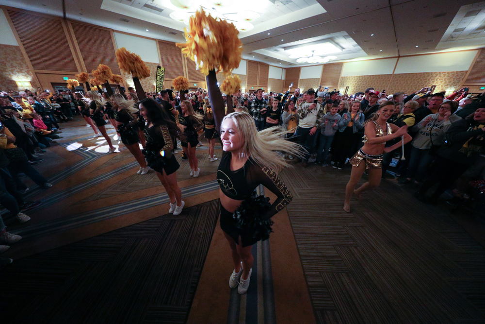 Members of the Iowa Spirit Squad perform during the Holiday Bowl Hawkeye Huddle Thursday, December 26, 2019 at the Hilton in downtown San Diego. (Brian Ray/hawkeyesports.com)