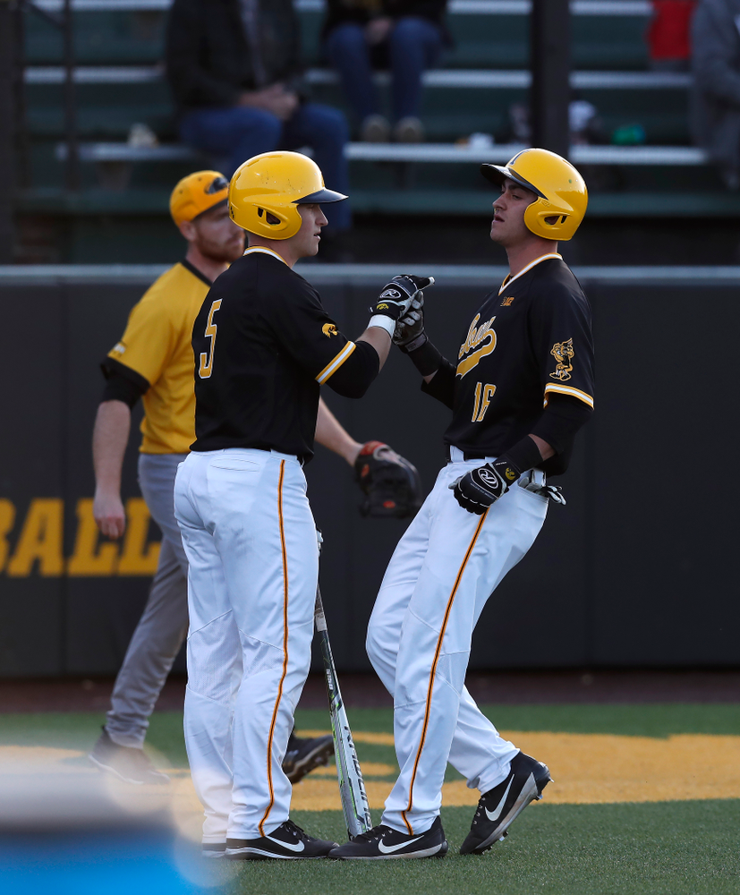 Iowa Hawkeyes catcher Tyler Cropley (5) and infielder Tanner Wetrich (16) against Milwaukee Wednesday, April 25, 2018 at Duane Banks Field. (Brian Ray/hawkeyesports.com)