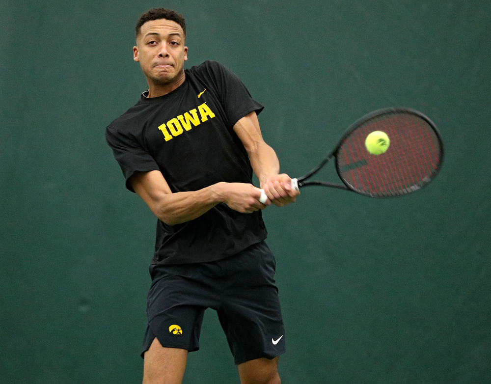 Iowa’s Oliver Okonkwo returns a shot during his doubles match at the Hawkeye Tennis and Recreation Complex in Iowa City on Friday, February 14, 2020. (Stephen Mally/hawkeyesports.com)