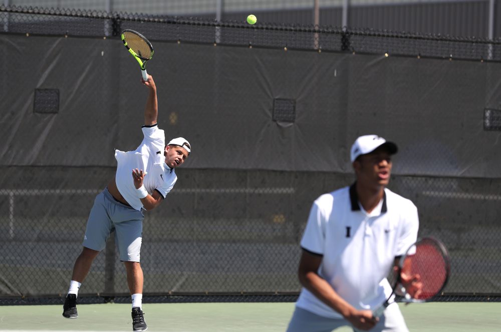 IowaÕs Oliver Okonkwo and Will Davies play a doubles match against the Michigan Wolverines Sunday, April 21, 2019 at the Hawkeye Tennis and Recreation Complex. (Brian Ray/hawkeyesports.com)