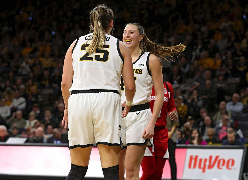 Iowa Hawkeyes forward Monika Czinano (25) celebrates with forward Amanda Ollinger (43) during the fourth quarter of the game at Carver-Hawkeye Arena in Iowa City on Thursday, February 6, 2020. (Stephen Mally/hawkeyesports.com)