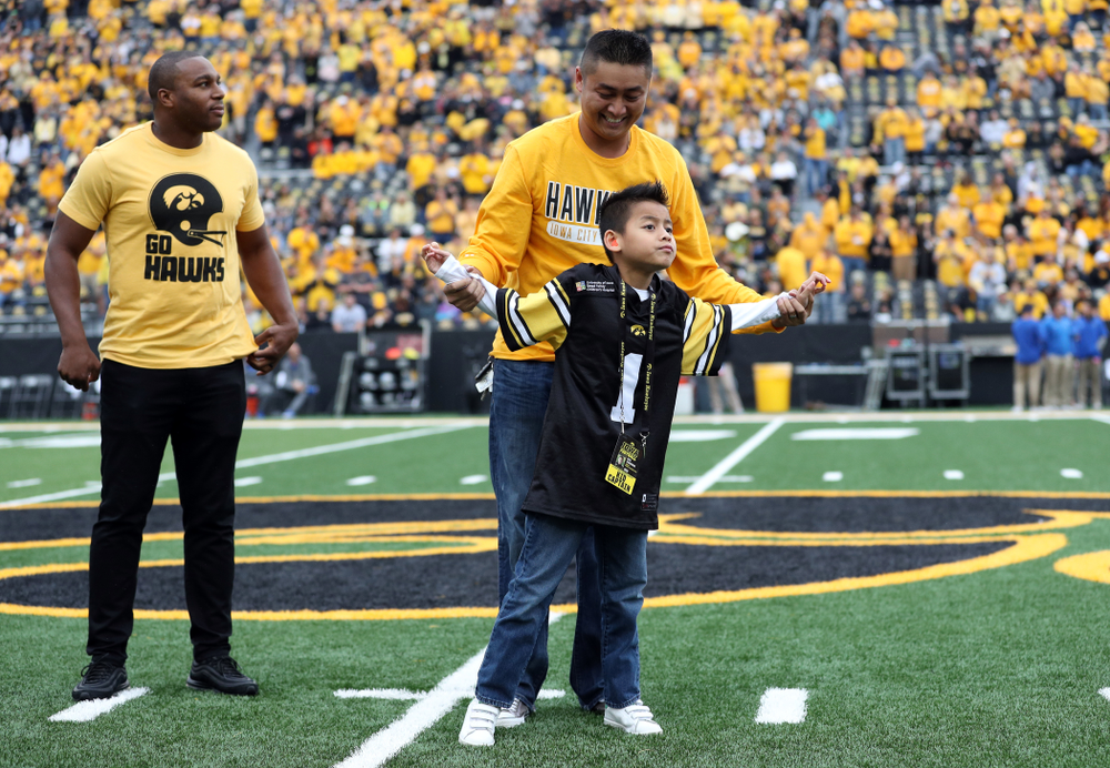 Stead Family ChildrenÕs Hospital Kid Captain Enzo Thongsoum and honorary captain Miguel Merrick before the Iowa Hawkeyes game against Middle Tennessee State Saturday, September 28, 2019 at Kinnick Stadium. (Max Allen/hawkeyesports.com)
