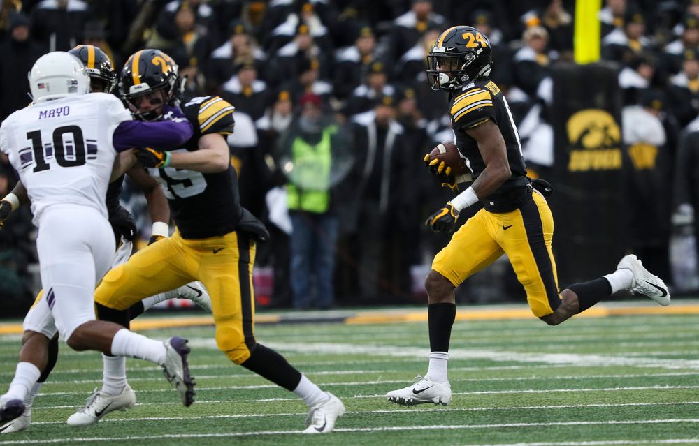 Iowa Hawkeyes wide receiver Ihmir Smith-Marsette (6) runs the ball during a game against Northwestern at Kinnick Stadium on November 10, 2018. (Tork Mason/hawkeyesports.com)