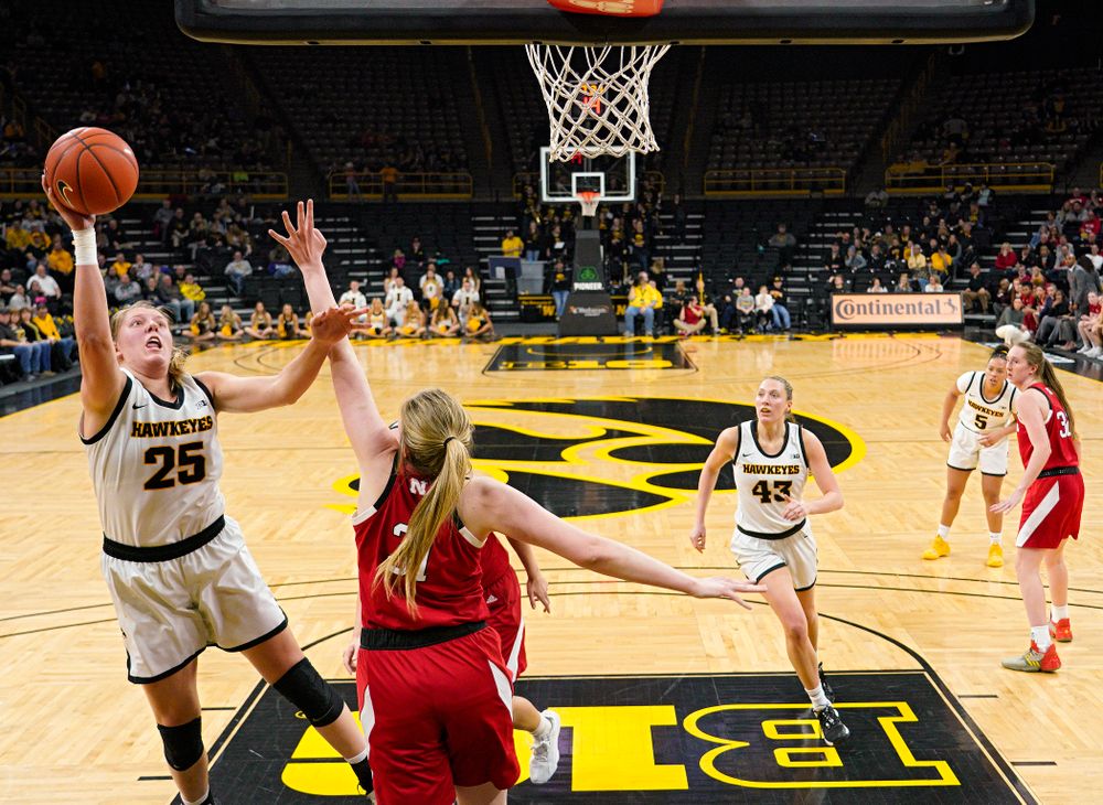 Iowa Hawkeyes forward Monika Czinano (25) makes a basket during the third quarter of the game at Carver-Hawkeye Arena in Iowa City on Thursday, February 6, 2020. (Stephen Mally/hawkeyesports.com)