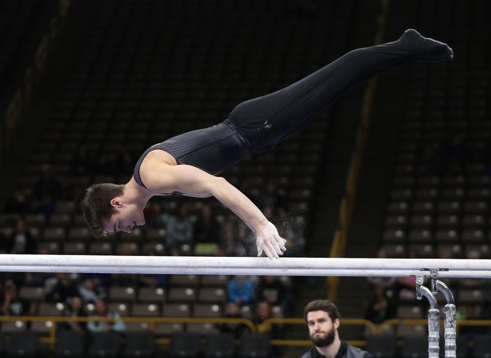 Iowa's Mitch Mandozzi competes on the parallel bars against the Ohio State Buckeyes Saturday, March 16, 2019 at Carver-Hawkeye Arena. (Brian Ray/hawkeyesports.com)