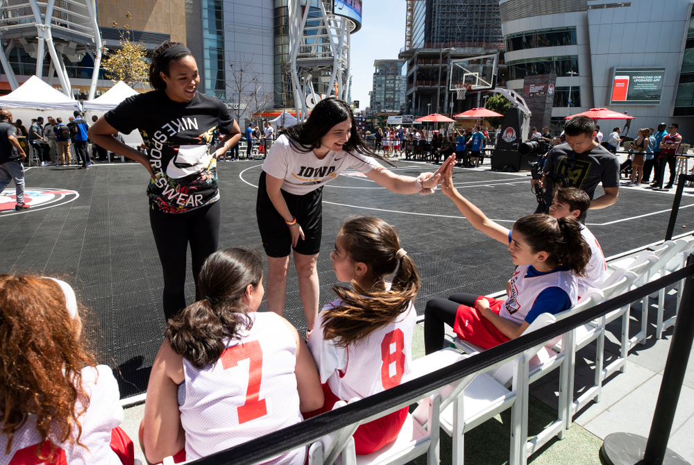 Iowa Hawkeyes forward Megan Gustafson (10) and UCONNÕs Napheesa Collier coach a team during a youth clinic and game Friday, April 12, 2019 in the XBOX Plaza at LA Live. (Brian Ray/hawkeyesports.com)