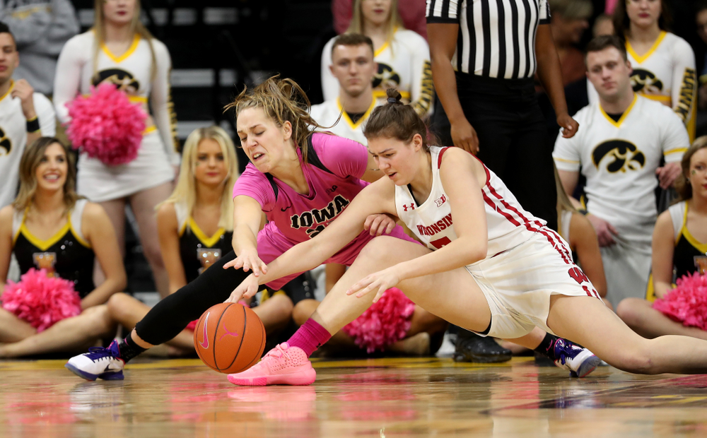 Iowa Hawkeyes guard Kathleen Doyle (22) battles for a loose ball against the Wisconsin Badgers Sunday, February 16, 2020 at Carver-Hawkeye Arena. (Brian Ray/hawkeyesports.com)