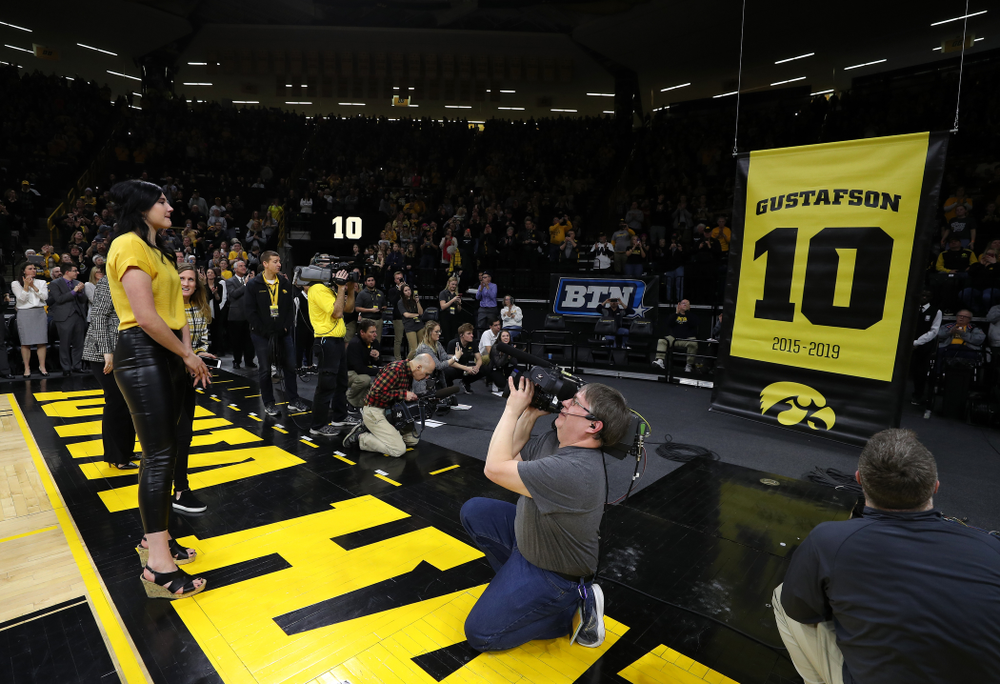Megan Gustafson stands with her family as her number is raised into the rafters during a jersey retirement ceremony Sunday, January 26, 2020 at Carver-Hawkeye Arena. (Brian Ray/hawkeyesports.com)