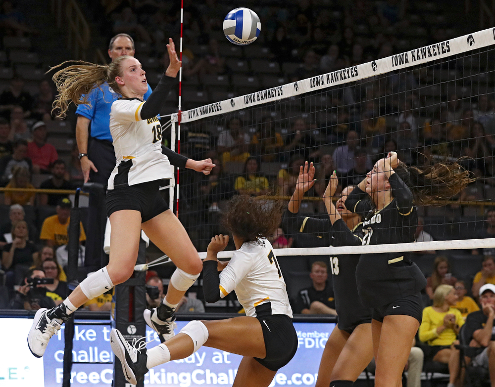 Iowa’s Hannah Clayton (18) tips the ball over the net during the third set of their Big Ten/Pac-12 Challenge match against Colorado at Carver-Hawkeye Arena in Iowa City on Friday, Sep 6, 2019. (Stephen Mally/hawkeyesports.com)