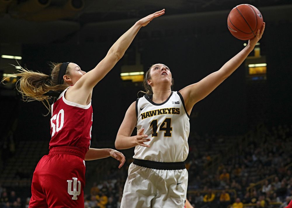 Iowa Hawkeyes guard Mckenna Warnock (14) makes a basket during the second quarter of their game at Carver-Hawkeye Arena in Iowa City on Sunday, January 12, 2020. (Stephen Mally/hawkeyesports.com)
