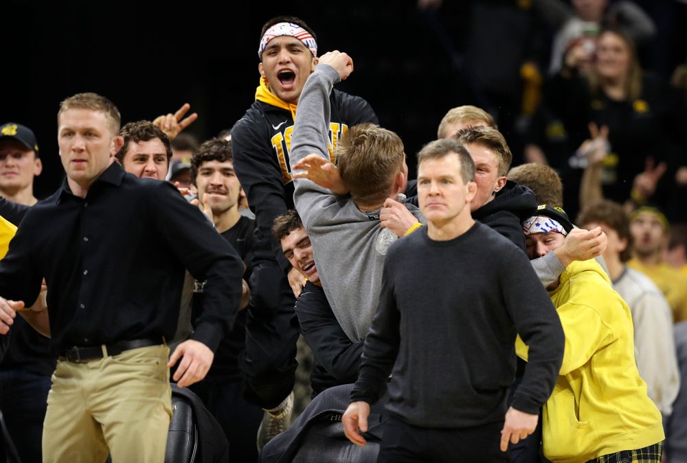 The Iowa bench cheers on cheers on Michael Kemerer in his 174-pound match during their dual at Carver-Hawkeye Arena in Iowa City on Friday, January 31, 2020. (Stephen Mally/hawkeyesports.com)