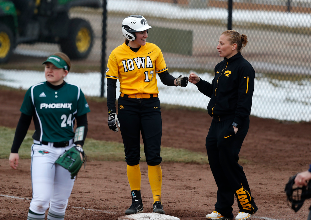 Iowa Hawkeyes outfielder Allie Wood (17) and assistant coach Adrianna Baggetta against UW Green Bay Tuesday, March 27, 2018 at Bob Pearl Field. (Brian Ray/hawkeyesports.com)