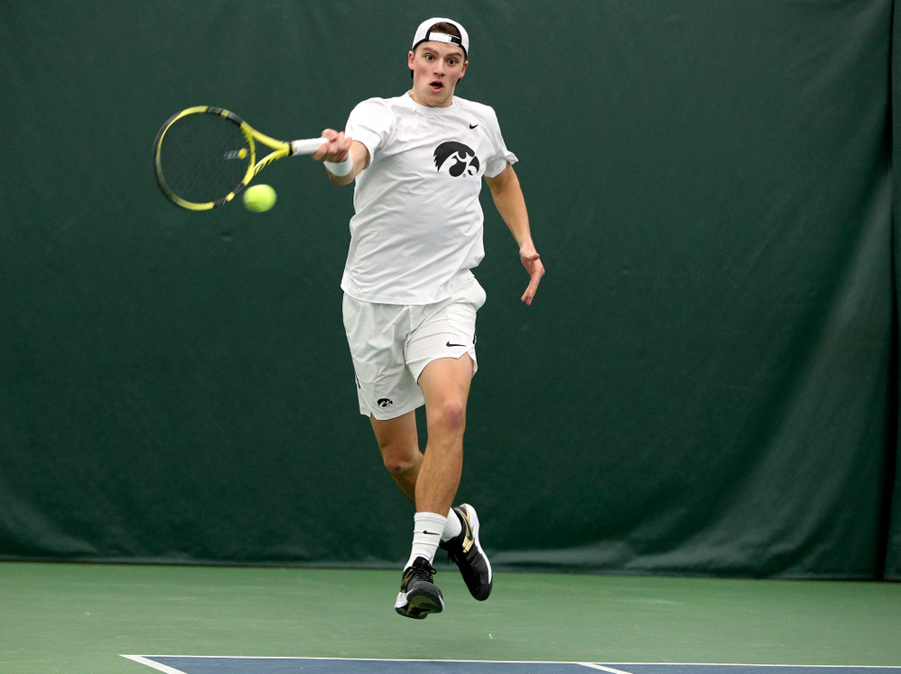 Iowa’s Joe Tyler returns a shot during his singles match at the Hawkeye Tennis and Recreation Complex in Iowa City on Sunday, February 16, 2020. (Stephen Mally/hawkeyesports.com)