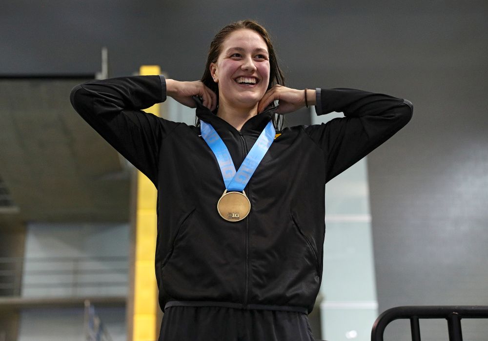 Iowa’s Hannah Burvill on the awards stand after placing third in the women’s 200 yard freestyle final event during the 2020 Women’s Big Ten Swimming and Diving Championships at the Campus Recreation and Wellness Center in Iowa City on Friday, February 21, 2020. (Stephen Mally/hawkeyesports.com)