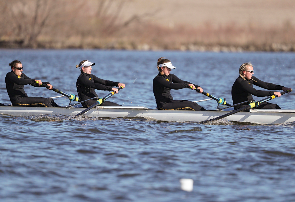 Iowa's Rachel Kram (from left), Lauren Collier, Noelle Ossenkop, and Erika Davidson during their I Novice 8 race against Wisconsin in their Big Ten Double Dual Rowing Regatta at Lake Macbride in Solon on Saturday, Apr. 13, 2019. (Stephen Mally/hawkeyesports.com)