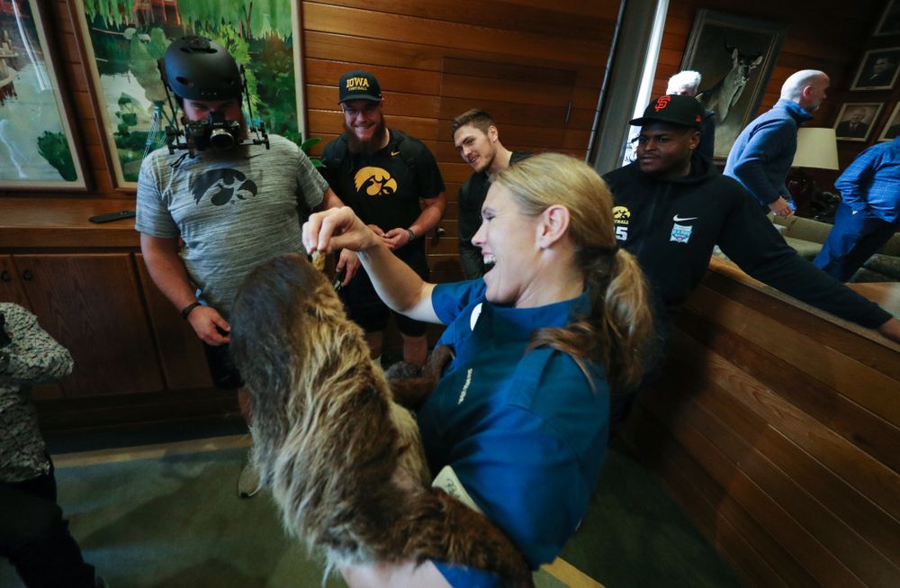 Iowa Hawkeyes offensive lineman Landan Paulsen (68), offensive lineman Levi Paulsen (66), linebacker Nick Niemann (49), and defensive lineman Cedrick Lattimore (95) check out a two toed sloth during a trip to the San Diego Zoo Wednesday, December 25, 2019 in San Diego. (Brian Ray/hawkeyesports.com)