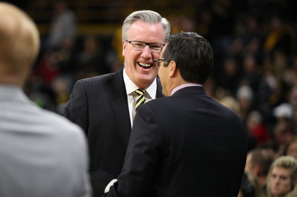 Iowa Hawkeyes head coach Fran McCaffery talks with Nebraska Cornhuskers head coach Tim Miles before their game Sunday, January 6, 2019 at Carver-Hawkeye Arena. (Brian Ray/hawkeyesports.com)