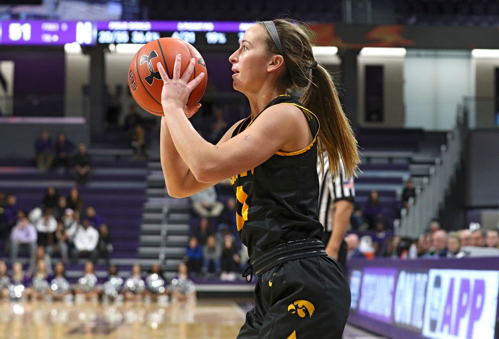 Iowa Hawkeyes guard Megan Meyer (11) makes a 3-pointer during the fourth quarter of their game at Welsh-Ryan Arena in Evanston, Ill. on Sunday, January 5, 2020. (Stephen Mally/hawkeyesports.com)