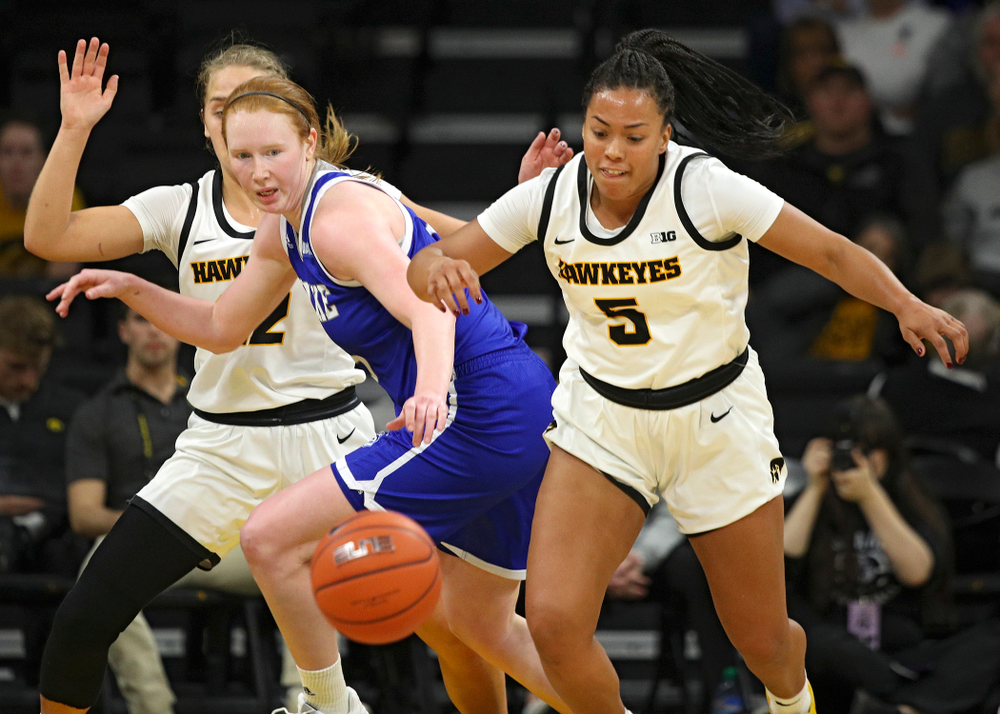 Iowa Hawkeyes guard Alexis Sevillian (5) steals the ball away during the third quarter of their game at Carver-Hawkeye Arena in Iowa City on Saturday, December 21, 2019. (Stephen Mally/hawkeyesports.com)