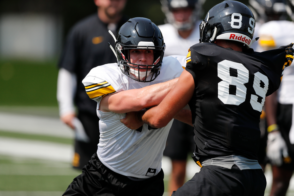 Iowa Hawkeyes defensive back John Milani (18) and wide receiver Nico Ragaini (89) during fall camp practice No. 9 Friday, August 10, 2018 at the Kenyon Practice Facility. (Brian Ray/hawkeyesports.com)