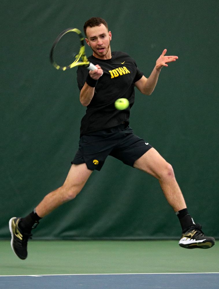 Iowa’s Kareem Allaf returns a shot during his singles match at the Hawkeye Tennis and Recreation Complex in Iowa City on Friday, March 6, 2020. (Stephen Mally/hawkeyesports.com)