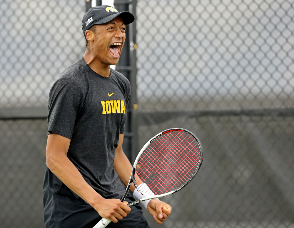 Iowa's Oliver Okonkwo celebrates as he competes during a match against Ohio State at the Hawkeye Tennis and Recreation Complex in Iowa City on Sunday, Apr. 7, 2019. (Stephen Mally/hawkeyesports.com)
