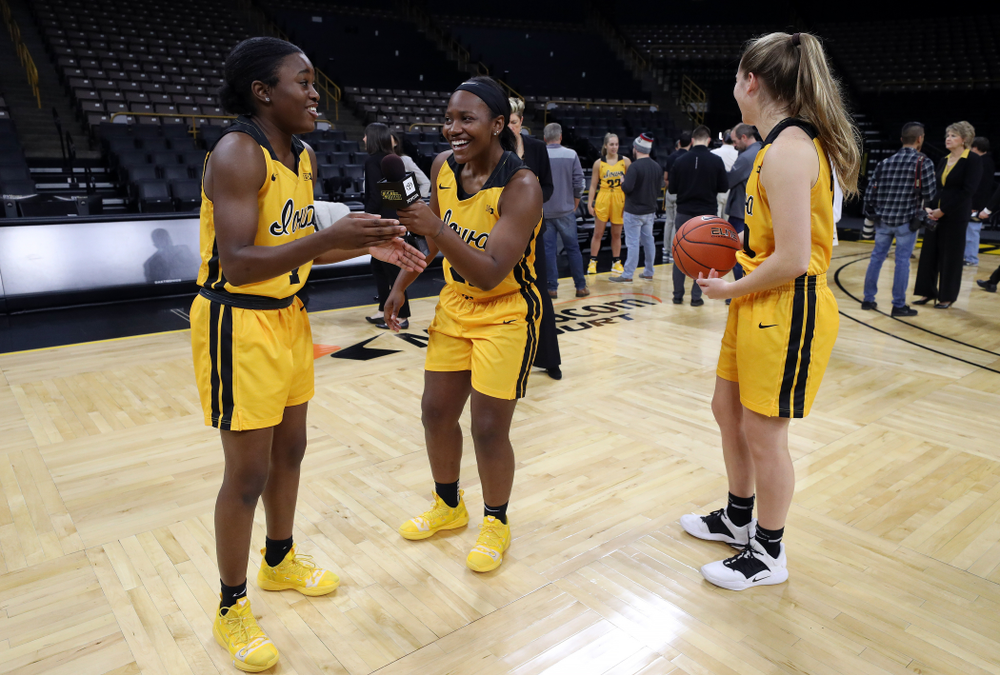 Iowa Hawkeyes guard Tomi Taiwo (1), guard Zion Sanders (21), and guard Kate Martin (20) during the teamÕs annual media day Thursday, October 24, 2019 at Carver-Hawkeye Arena. (Brian Ray/hawkeyesports.com)
