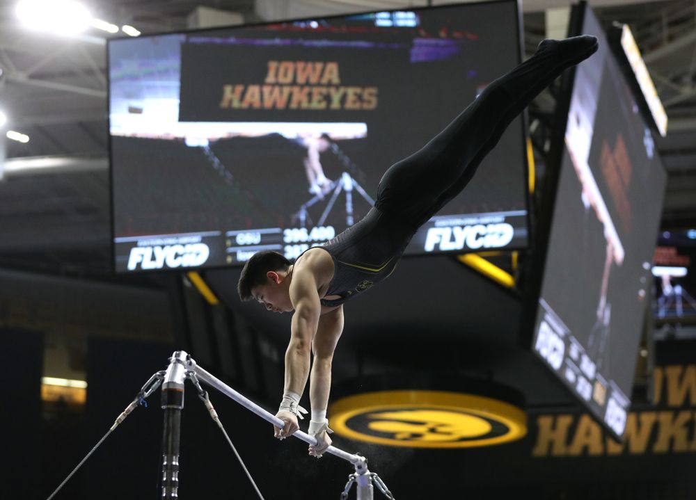 Iowa's Bennet Huang competes on the high bar against the Ohio State Buckeyes Saturday, March 16, 2019 at Carver-Hawkeye Arena. (Brian Ray/hawkeyesports.com)