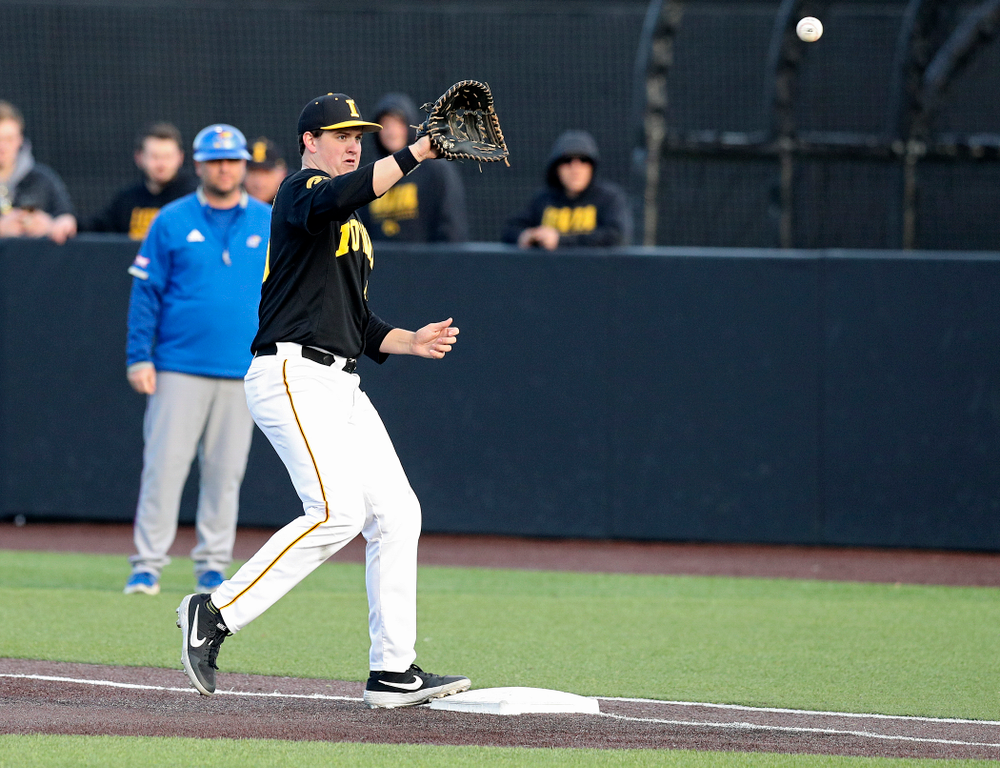 Iowa first baseman Peyton Williams (45) looks in a throw for an out during the seventh inning of their college baseball game at Duane Banks Field in Iowa City on Tuesday, March 10, 2020. (Stephen Mally/hawkeyesports.com)