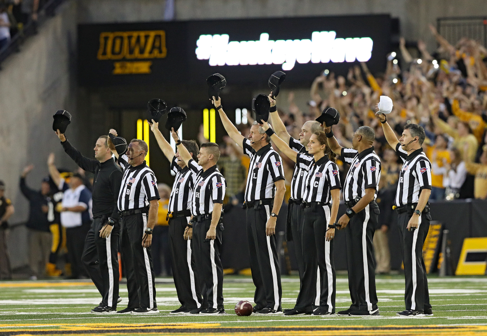 The officials wave to the University of Iowa Stead Family Children’s Hospital between the first and second quarter of their game at Kinnick Stadium in Iowa City on Saturday, Aug 31, 2019. (Stephen Mally/hawkeyesports.com)