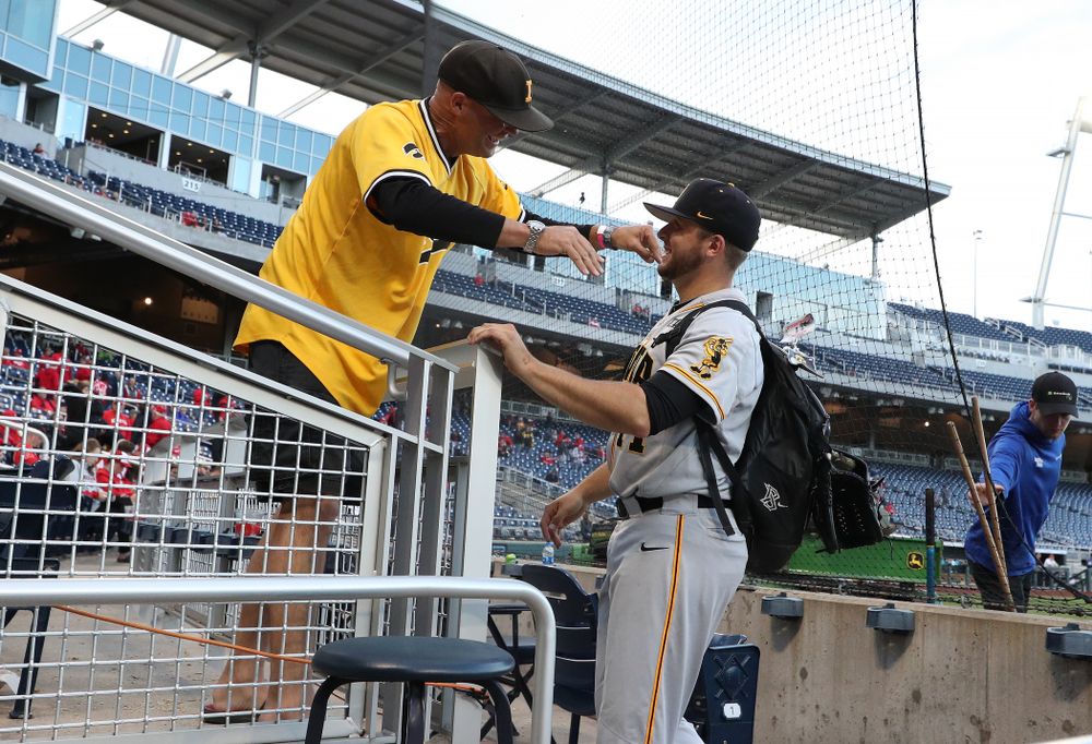 Iowa Hawkeyes Cole McDonald (11) hugs his father after getting the win against the Indiana Hoosiers in the first round of the Big Ten Baseball Tournament Wednesday, May 22, 2019 at TD Ameritrade Park in Omaha, Neb. (Brian Ray/hawkeyesports.com)