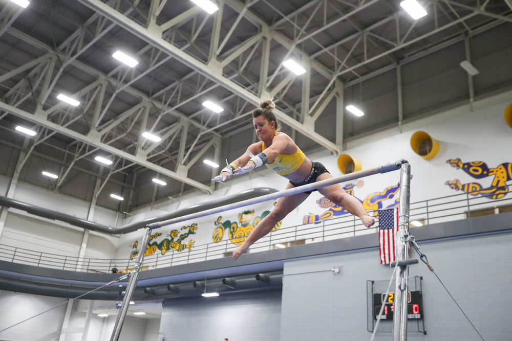 Maddie Kampschroeder performs on the uneven bars during the Iowa women’s gymnastics Black and Gold Intraquad Meet on Saturday, December 7, 2019 at the UI Field House. (Lily Smith/hawkeyesports.com)
