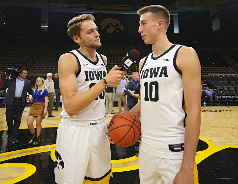 Iowa Hawkeyes forward Riley Till (20) asks guard Joe Wieskamp (10) a question during Iowa Men’s Basketball Media Day at Carver-Hawkeye Arena in Iowa City on Wednesday, Oct 9, 2019. (Stephen Mally/hawkeyesports.com)
