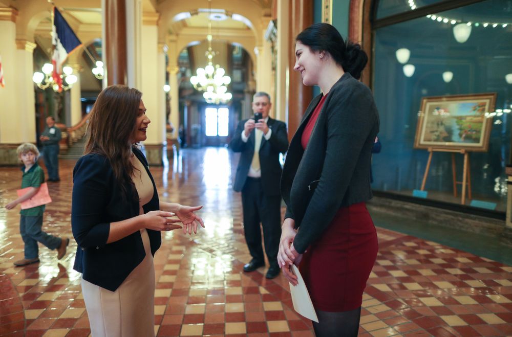 Iowa’s Megan Gustafson meets U.S. Representative Abby Finkenauer in the rotunda at the Iowa State Capitol Wednesday, April 24, 2019 in Des Moines. (Brian Ray/hawkeyesports.com)