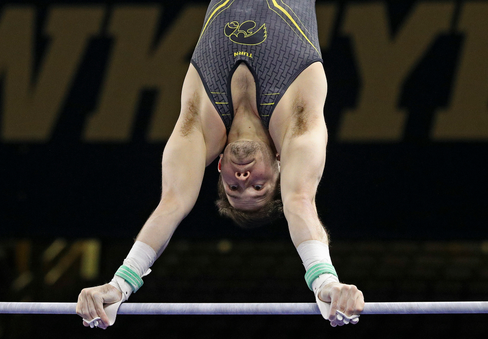Iowa's Rogelio Vazquez competes in the horizontal bar during the first day of the Big Ten Men's Gymnastics Championships at Carver-Hawkeye Arena in Iowa City on Friday, Apr. 5, 2019. (Stephen Mally/hawkeyesports.com)