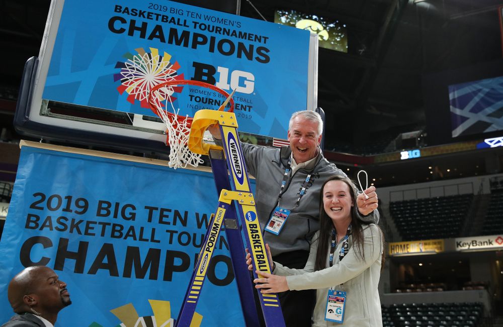 Athletics Director Gary Barta cuts down the net as they celebrate their victory over the Maryland Terrapins in the Big Ten Championship Game Sunday, March 10, 2019 at Bankers Life Fieldhouse in Indianapolis, Ind. (Brian Ray/hawkeyesports.com)