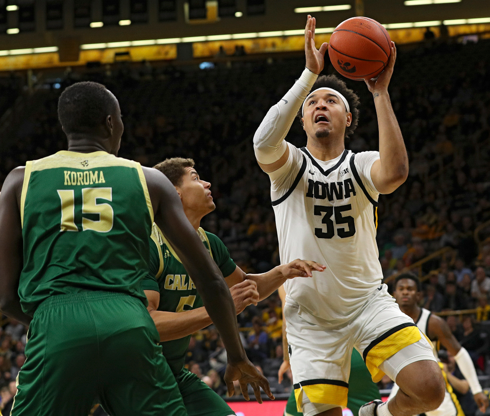 Iowa Hawkeyes forward Cordell Pemsl (35) puts up a shot during the first half of their game at Carver-Hawkeye Arena in Iowa City on Sunday, Nov 24, 2019. (Stephen Mally/hawkeyesports.com)
