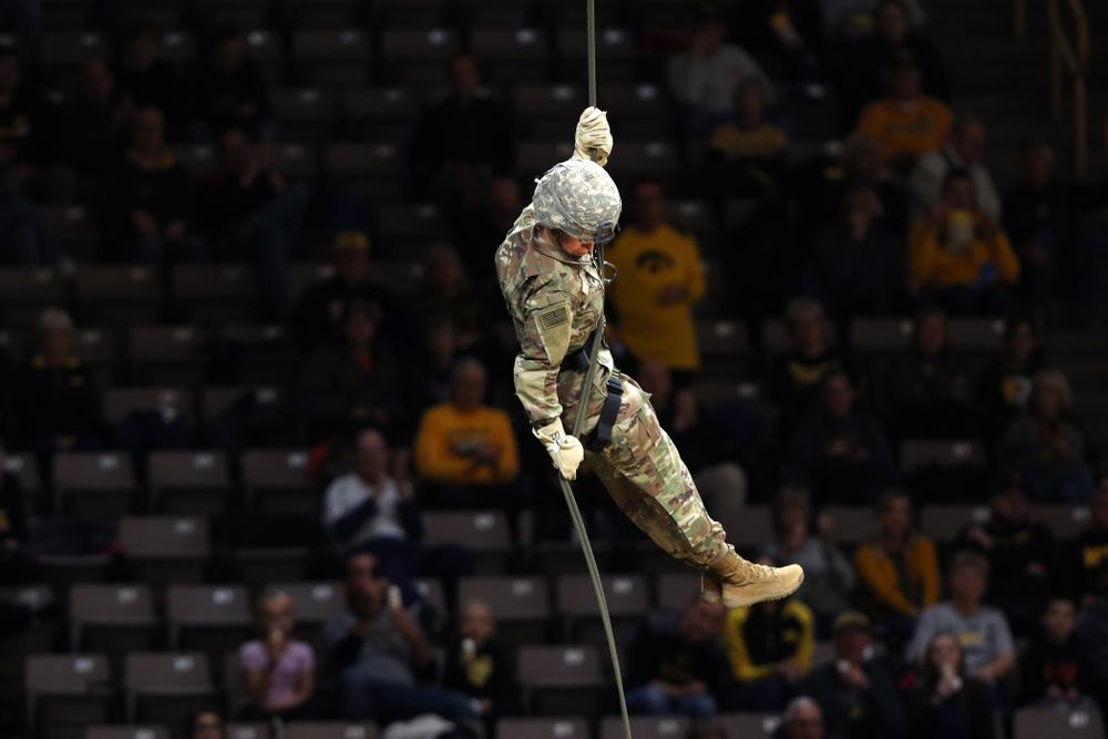 Members of the University of Iowa ROTC cadre repel down from the rafters before the Iowa Hawkeyes game against UW Green Bay Sunday, November 11, 2018 at Carver-Hawkeye Arena. (Brian Ray/hawkeyesports.com)