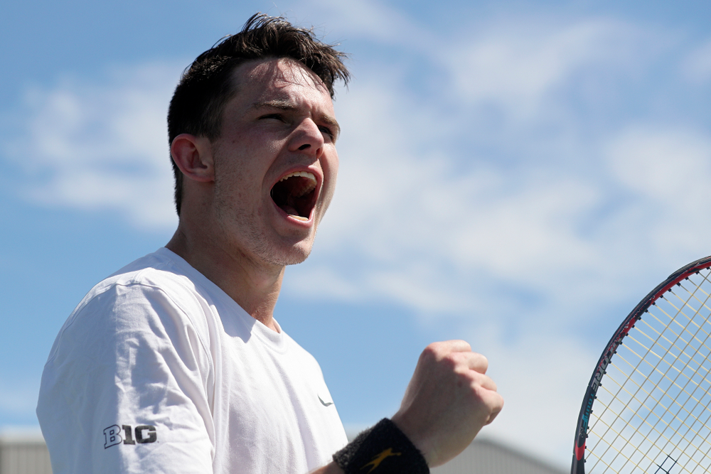 Iowa's Jonas Larson shouts during his match against Michigan at the Hawkeye Tennis and Recreation Complex in Iowa City on Sunday, Apr. 21, 2019. (Stephen Mally/hawkeyesports.com)