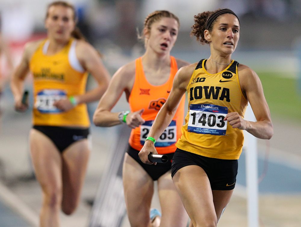 Iowa's Tia Saunders runs the women's 3200 meter relay event during the second day of the Drake Relays at Drake Stadium in Des Moines on Friday, Apr. 26, 2019. (Stephen Mally/hawkeyesports.com)
