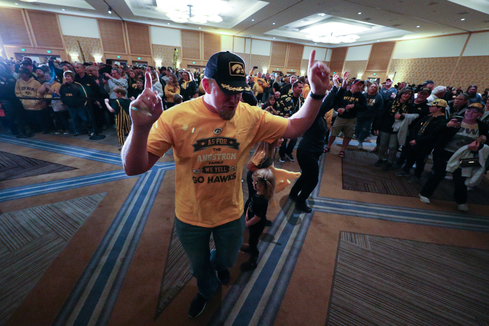 Fans dance to the Hokey Pokey in honor of the late Hayden Fry during the Holiday Bowl Hawkeye Huddle Thursday, December 26, 2019 at the Hilton in downtown San Diego. (Brian Ray/hawkeyesports.com)