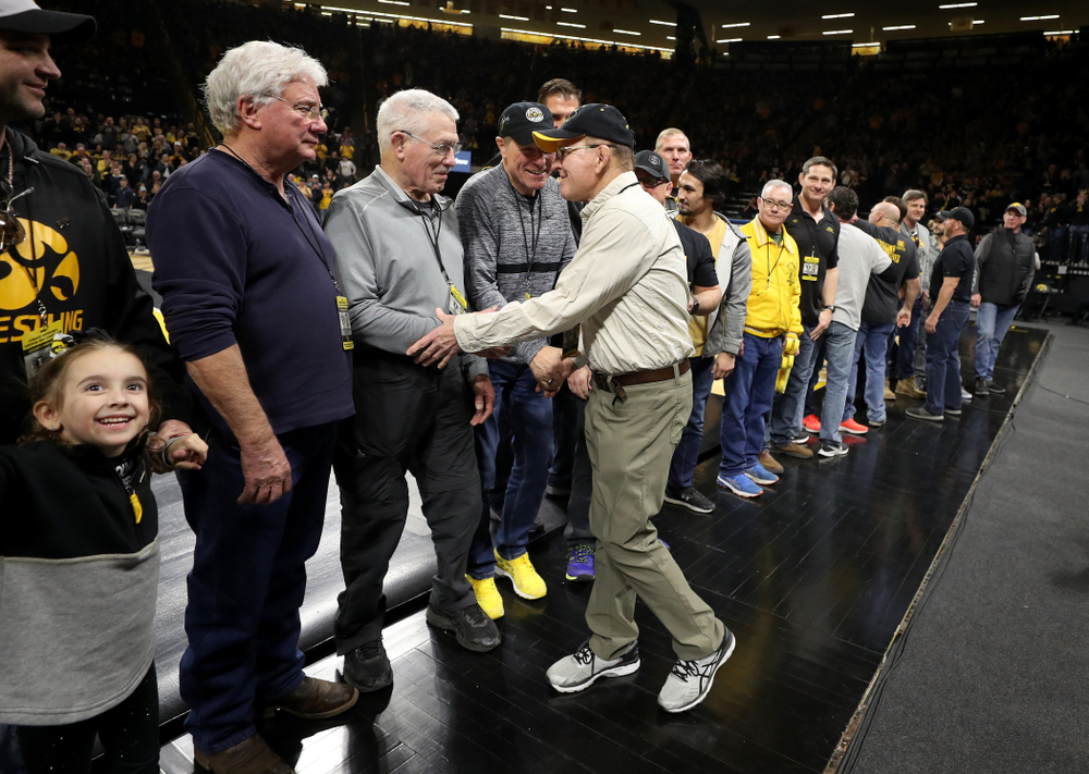 Legendary former head coach Dan Gable shakes hands with Iowa Wrestling alumni during the Iowa Hawkeyes dual against Oklahoma State Sunday, February 23, 2020 at Carver-Hawkeye Arena. (Brian Ray/hawkeyesports.com)