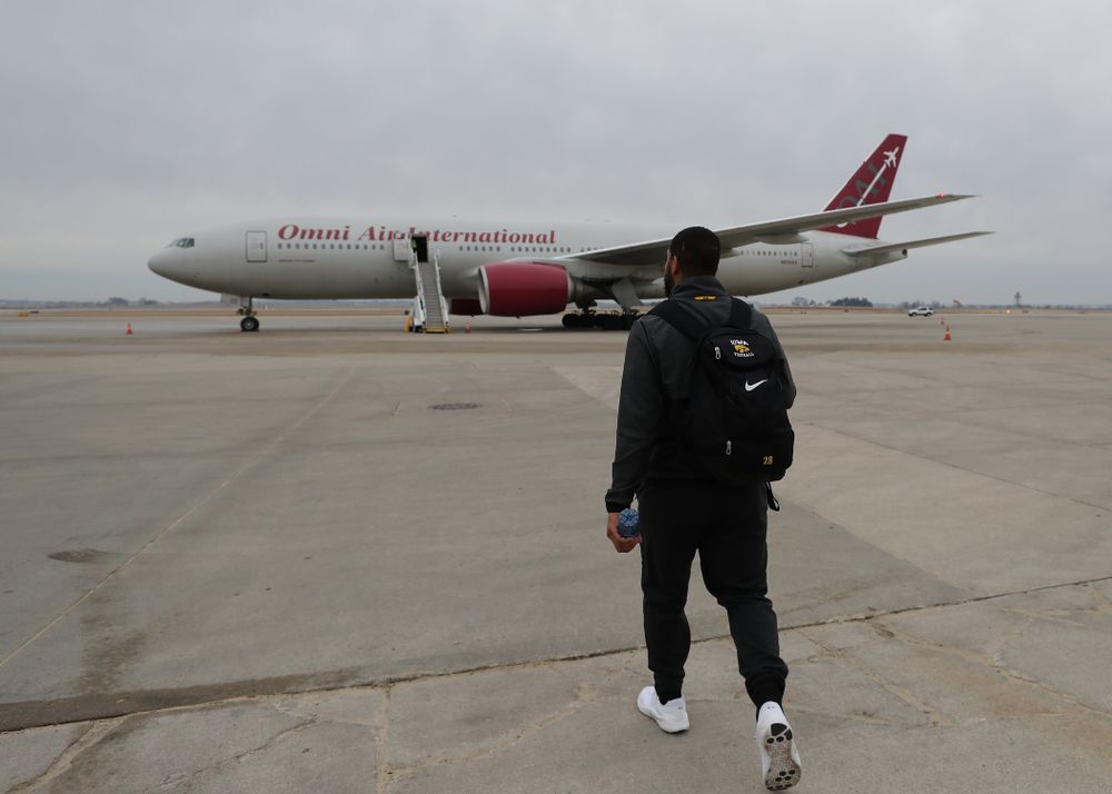 Iowa Hawkeyes running back Toren Young (28) boards the team plane Wednesday, December 26, 2018 as they travel to Tampa, Florida for the Outback Bowl. (Brian Ray/hawkeyesports.com)